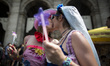 Two people kiss each other as they attend a gay pride parade as part of Roma Pride 2017 in...