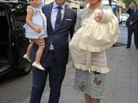 Gema Ruiz Cuadrado and her husband, Juan Diaz, went to the parish of San Antón to baptize their son Juan. Madrid. Spain. June 11, 2017 (