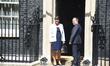 DUP leader Arlene Foster (L) and MP Nigel Dodds arrive at 10 Downing Street on June 13, 20...