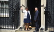 DUP leader Arlene Foster (L) and MP Nigel Dodds arrive at 10 Downing Street on June 13, 20...
