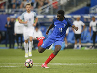 France's forward Ousmane Dembele shoots the ball during the international friendly football match between France and England, on June 13, 20...