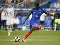 France's forward Ousmane Dembele shoots the ball during the international friendly football match between France and England, on June 13, 20...