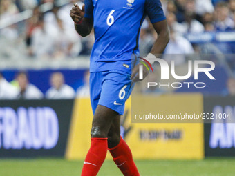 France's midfielder Paul Pogba passes the ball during the international friendly football match between France and England, on June 13, 2017...