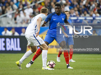 France's midfielder Paul Pogba (C) during the international friendly football match between France and England, on June 13, 2017 at the Stad...