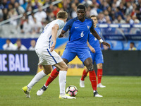 France's midfielder Paul Pogba (C) during the international friendly football match between France and England, on June 13, 2017 at the Stad...