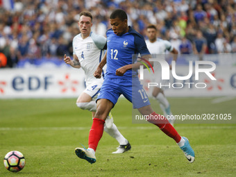 France's forward Kylian Mbappe controls the ball during the international friendly football match between France and England, on June 13, 20...