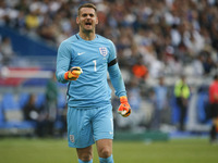 England's goalkeeper Tom Heaton reacts during the international friendly football match between France and England at The Stade de France St...