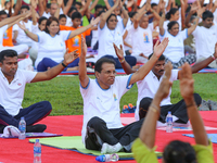 Sri Lankan president Maithripala Sirisena(C) performs Yoga during an event to mark the International Yoga Day at the Independence Square, Co...