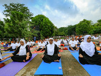 Sri Lankan Muslim women perform Yoga during an event to mark the International Yoga Day at the Independence Square, Colombo, Sri Lanka on Sa...