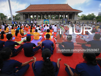 Sri Lankan participants perform Yoga during an event to mark the International Yoga Day at the Independence Square, Colombo, Sri Lanka on Sa...