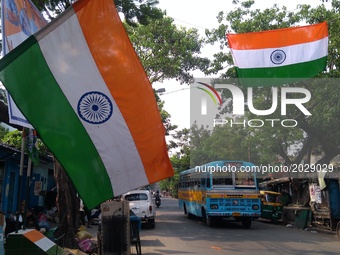 Indian cricket lover hanging Indian national flag  road side during India v Pakistan final ICC  champion trophy Cricket Matches on June 18,2...