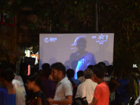 Iindian cricket fans watch India vs Pakistan final cricket match of Champions trophy , on a big projector  screen , in Allahabad on June 18,...