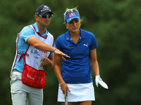 Lexi Thompson of Coral Springs, Florida reviews the 7th green with her caddy before putting during the final round of the Meijer LPGA Classi...
