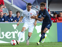 Mason Holgate (ENG), Jaroslav Mihalik (SLO)  during the UEFA U-21 European Championship Group A football match Slovakia vs England in Kielce...