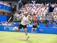 Australia's Jordan Thompson returns to Sam Querrey of the US during their men's singles second round tennis match at the ATP Aegon Champions...