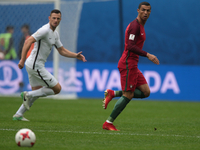 Cristiano Ronaldo (R) of the Portugal national football team vie for the ball during the 2017 FIFA Confederations Cup match, first stage - G...