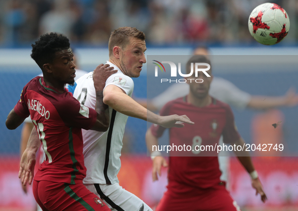 Nélson Semedo (L) of the Portugal national football team and Chris Wood of the New Zealand national football team vie for the ball during th...