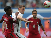Nélson Semedo (L) of the Portugal national football team and Chris Wood of the New Zealand national football team vie for the ball during th...