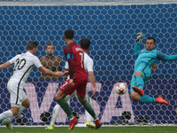 Stefan Marinovic (R) of the New Zealand national football team vie for the ball during the 2017 FIFA Confederations Cup match, first stage -...