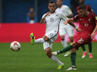 Clayton Lewis (L) of the New Zealand national football team and Bernardo Silva of the Portugal national football team vie for the ball durin...