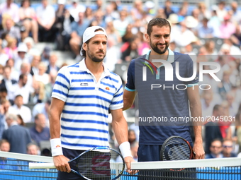 Feliciano Lopez of Spain (L) and his opponant Marin Cilic of Croatia (R) pose for photos prior to the mens singles final on day seven of the...