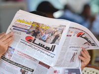 A person reads 'Al Massae' - an Arabic-speaking Moroccan daily, reporting on yesterday's violent demonstrations and riots that took place in...
