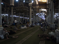 Muslims restes inside Al-Hussein Mosque in Cairo during the Holy month of Ramadan on June 13, 2017 (
