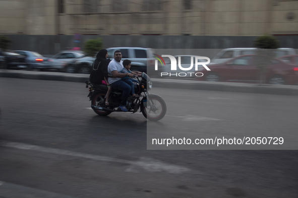 A whole Egyptian family in motocycle in Cairo downtown  on June 16, 2017 