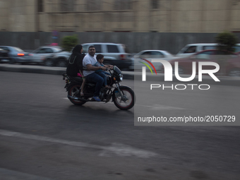 A whole Egyptian family in motocycle in Cairo downtown  on June 16, 2017 (