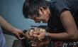 A relative mourns over the body of Julius Soriano, who was shot dead by police following a...