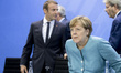 German Chancellor Angela Merkel (R), President of the European Commission Jean-Claude Junc...