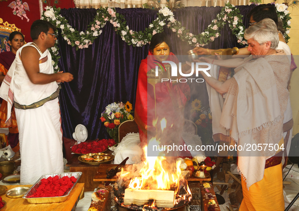 Her Holiness Amma Sri Karunamayi along with Hindu priests perform special prayers during the Homa (sacred fire ceremony) at the Bhuvaneswari...
