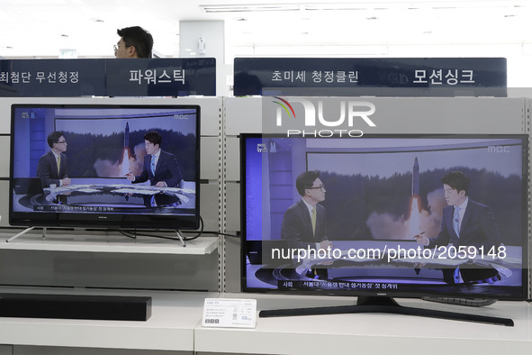 TV screens at a Uijeongbu Electronic shop show a North Korean newscaster reading a public announcement at in Gyeongigi province, South Korea...