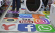Social media stickers are seen on the floor at a shopping mall in Ankara, Turkey on July 0...