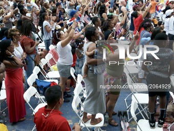The crowd gets up on their feet at the WaWa Welcome America Independence Day concert on the Benjamin Franklin Parkway, in Philadelphia, PA,...