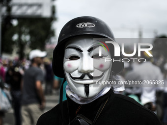 Demonstrators use mask to cover their faces from the security forces. Caracas on Saturday 1 of July.  This July 9th, Venezuela will reach 10...