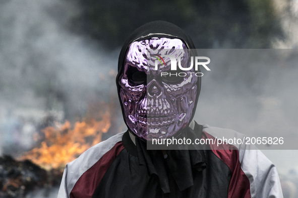 Demonstrators use mask to cover their faces from the security forces. Caracas on Thursday 29 of June.  This July 9th, Venezuela will reach 1...