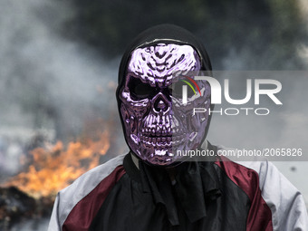 Demonstrators use mask to cover their faces from the security forces. Caracas on Thursday 29 of June.  This July 9th, Venezuela will reach 1...
