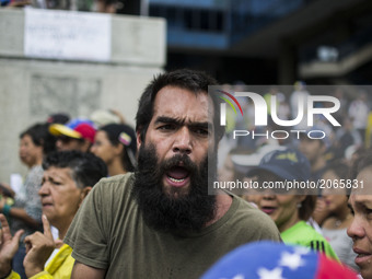A group of opposition activists sing slogans against the government during a rally. Caracas on Saturday 24 of June.  This July 9th, Venezuel...