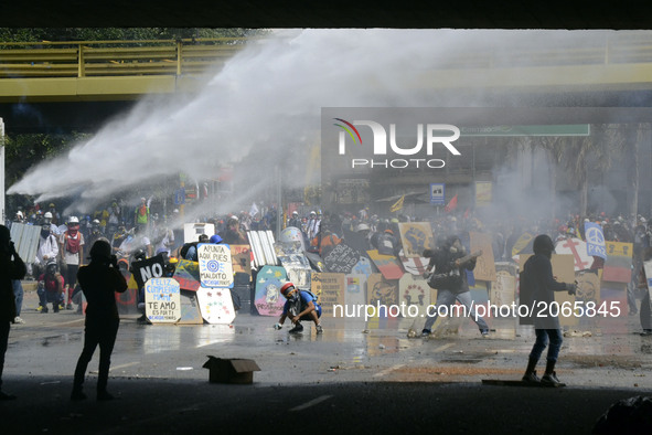 Security forces use a water cannon as the demonstrators coverthemselves with homemade shields. Caracas on Monday 29 of May.  This July 9th,...