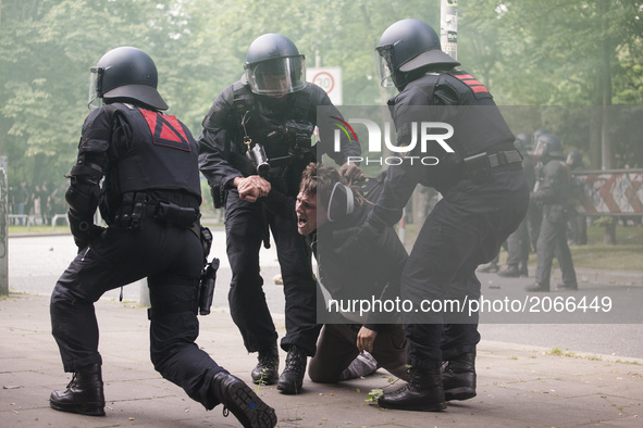 Germany, Hamburg: Riot police arrests a demonstrator during protests  during the G20 summit in Hamburg, Germany, on July 7, 2017. 