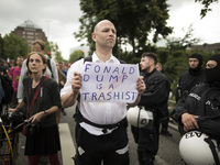 Germany, Hamburg: A man shows a placard against Donald Trump during the 'Hamburg Shows Attitude' demonstration in Hamburg, Germany,  on July...