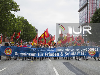 People march during a protest demonstration against the G20 Summit with the topic 'Solidarity without borders instead of G20' in Hamburg, Ge...