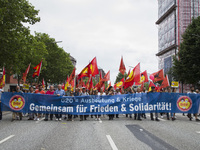 People march during a protest demonstration against the G20 Summit with the topic 'Solidarity without borders instead of G20' in Hamburg, Ge...