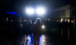 An demonstrator juggles in front of a water cannon, in Hamburg, on July 8, 2017. Aer the p...