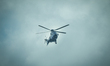 A helicopter is seen flying through a window of the Hamburg Messe congress center where th...