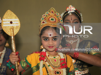 Tamil Hindu girls perform a classical Bharatnatyam dance honouring Lord Murugan during the Kanthaswamy Ther Festival at a Tamil Hindu temple...