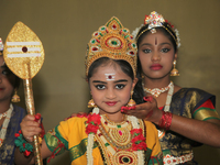 Tamil Hindu girls perform a classical Bharatnatyam dance honouring Lord Murugan during the Kanthaswamy Ther Festival at a Tamil Hindu temple...