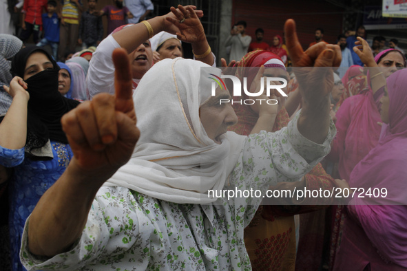 A kashmiri women chants pro-freedom slogans during the funeral of a local pro-Independence fighter Aqib Ahmad in Srinagar on july 12 ,2017....