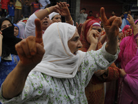 A kashmiri women chants pro-freedom slogans during the funeral of a local pro-Independence fighter Aqib Ahmad in Srinagar on july 12 ,2017....